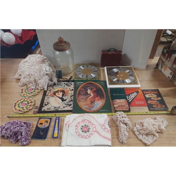 Collection of vintage collectibles including Eaton's catalogs and handcrafted textiles, etc.