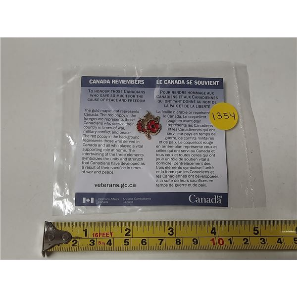 Canada Remembers pin. Gold Maple Leaf with Red Poppy. Housed in its original unopened Veterans Affai
