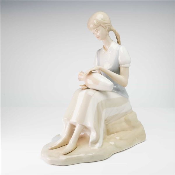 Italian Porcelain Figurine of a Seated Girl with Pottery