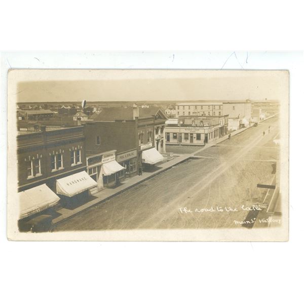 1912 RPPC – “The Road to the Lake.  Main St. Watrous” Sask.