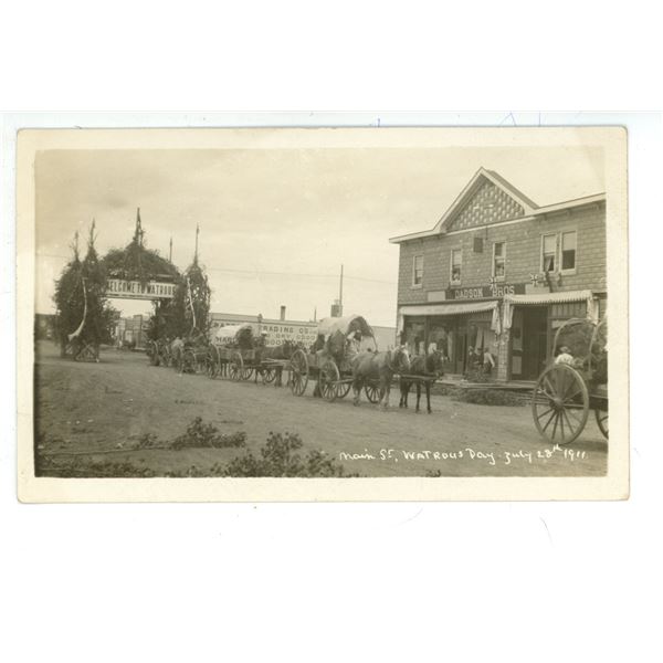 RPPC – “Main St. Watrous Day.  July 28th, 1911”.  Watrous, Sask.