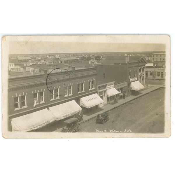 1912 RPPC – “Main St. Watrous, Sask”.  Posted.