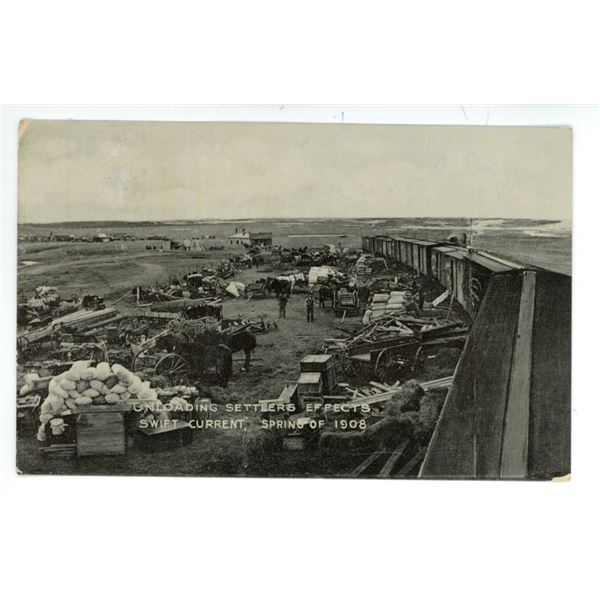 1909 RPPC - “Unloading Settlers Effects.  Swift Current, Spring of 1908”