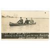 Image 1 : 1909 RPPC – “Who Says Dry Belt?  Canoeing on Railway St. … June 21st [x=#