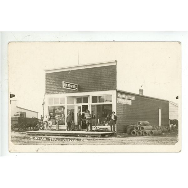 1912 RPPC – “Winkler Bros.  Luseland, Sask.”  Posted.