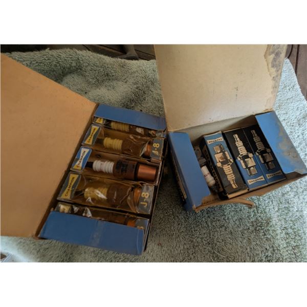 Two Boxes of Champion Spark Plugs (New and Used)
