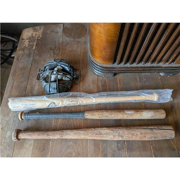 Three Baseball Bats and a Back Catchers Mask