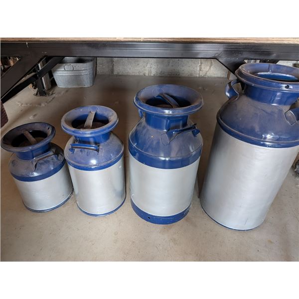Four Graduating Cream and Milk Cans