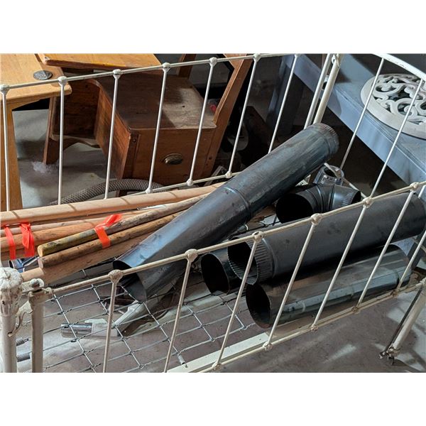 Stove Pipe Axe Handles in a Doll Crib