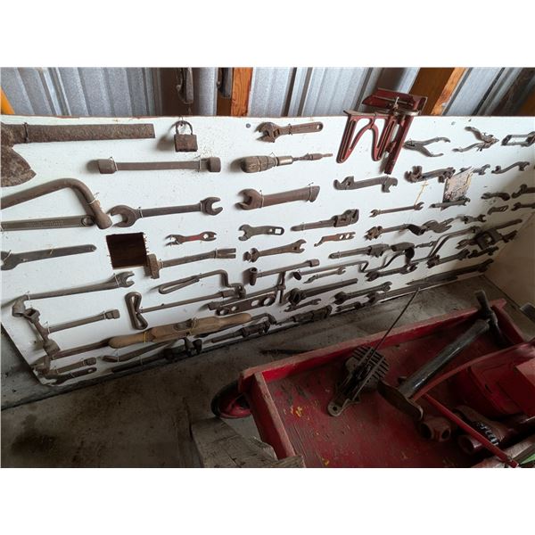 Collection of Tools Attached to White 4' x10' Board Axe and Large Hand Tools