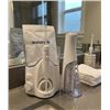 Image 1 : Waterpik Water Flosser and Cordless Model System with Accessories