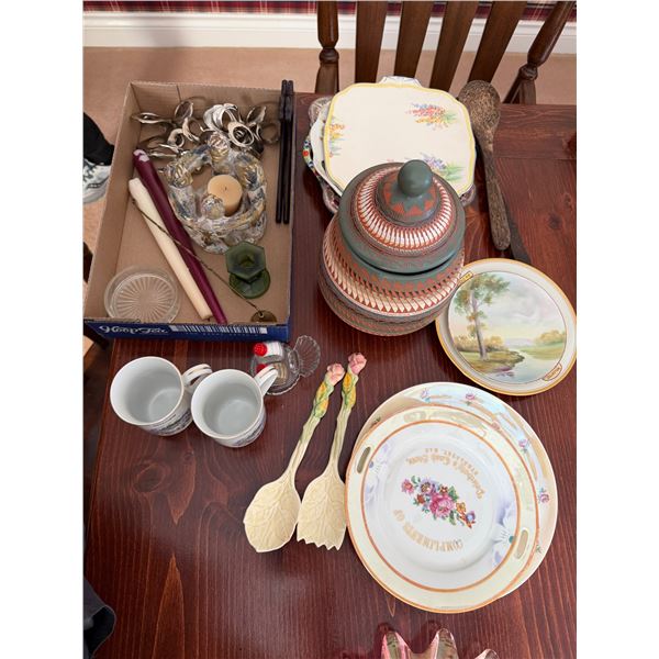 Serving plates, mugs, salad, spoons, salt, and pepper shakers
