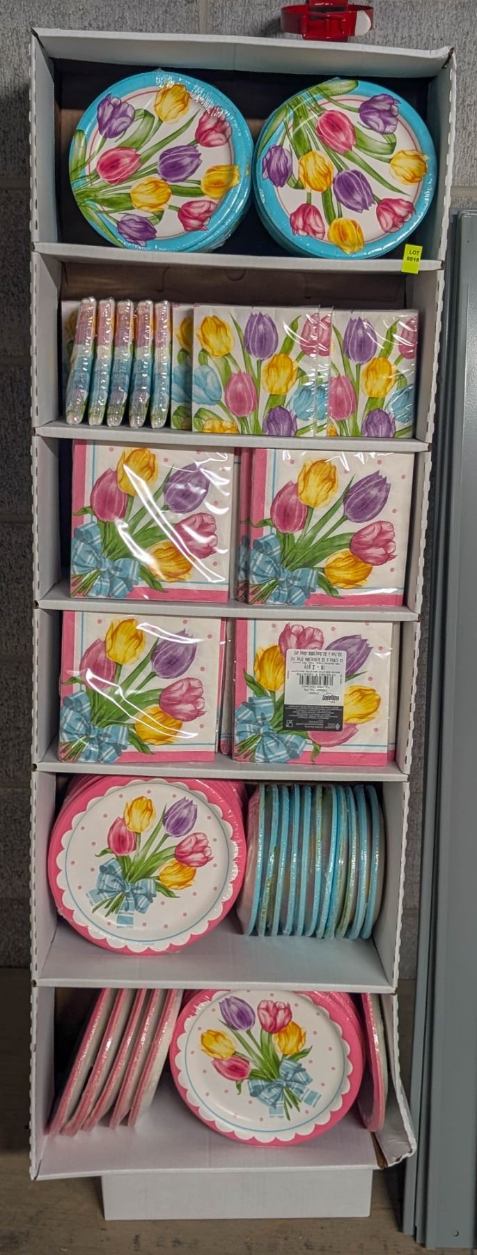 DISPLAY RACK OF FLORAL PAPER PLATES AND NAPKINS
