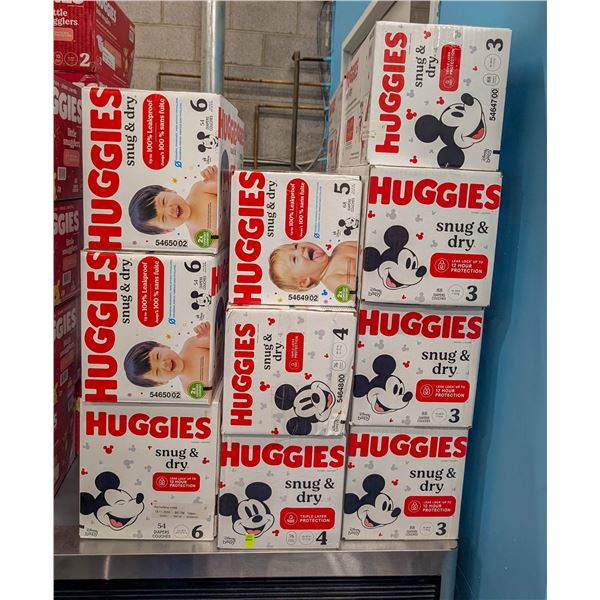 LARGE LOT OF HUGGIES SNUG AND DRY DIAPERS SIZES