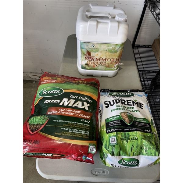 2 BAGS AND JUG OF LAWN FOOD AND FERITLIZER