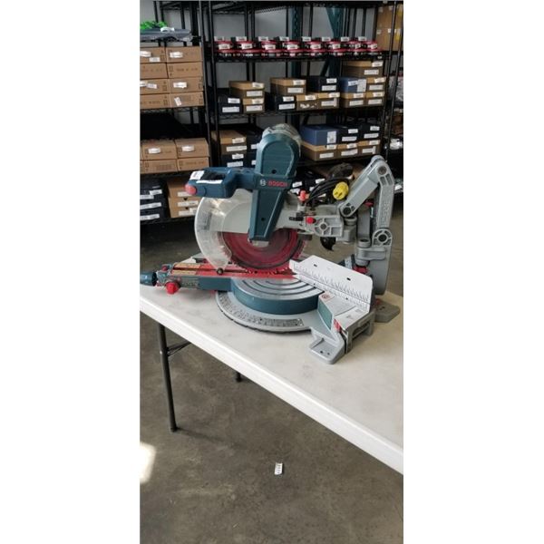 BOSCH GCM12SD 12 INCH DUAL BEVEL HINGE SLIDE MITRE SAW WITH DIABLO BLADE, IN GOOD CONDITION, TESTED 