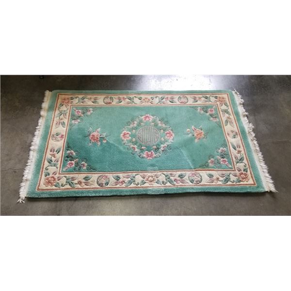 GREEN WOOL AREA CARPET, 64 X 37 INCH