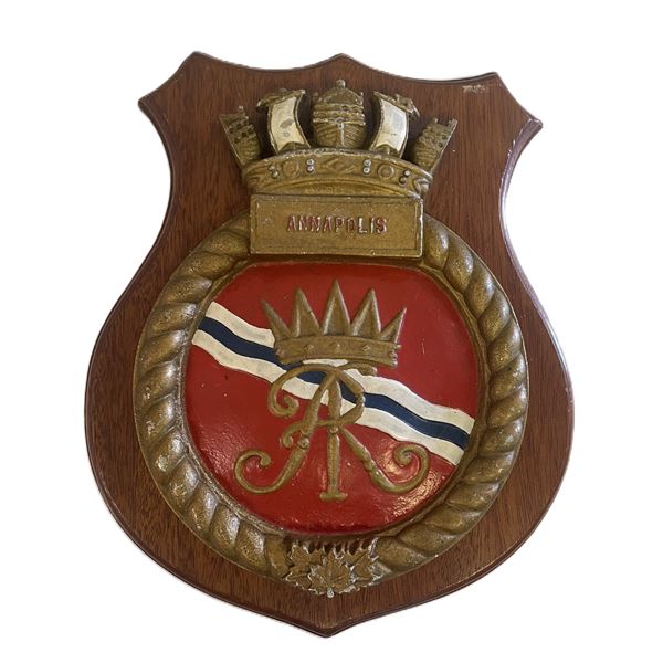 HMCS Annapolis ship's badge mounted on a wooden wall plaque