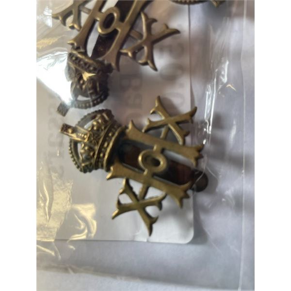 TWO brass cap badges for the 20th Hussars, British Army regiment
