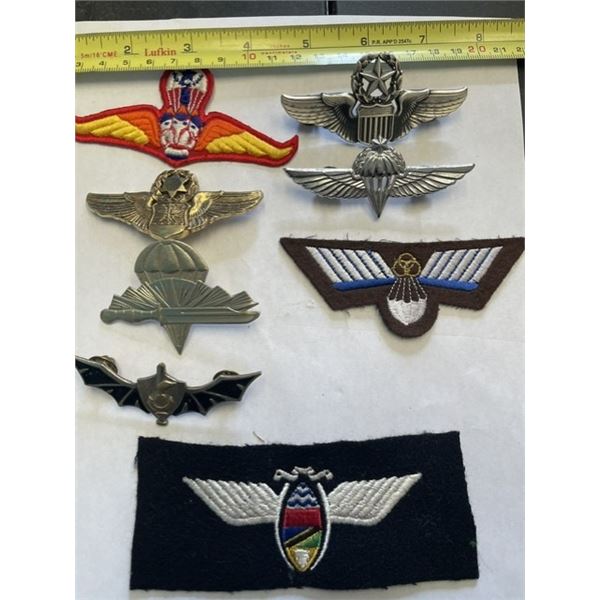 Collection of worldwide military parachutist and air force insignia, metal and embroidered