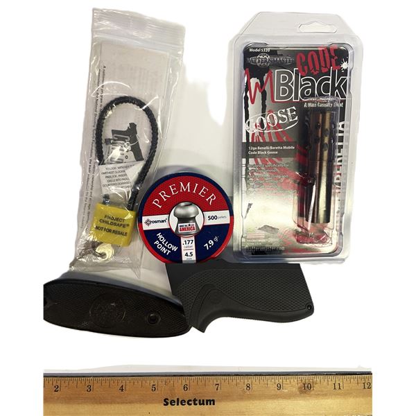 firearm accessories, including a black Pachmayr Compac grip designed for Rossi small-frame revolvers