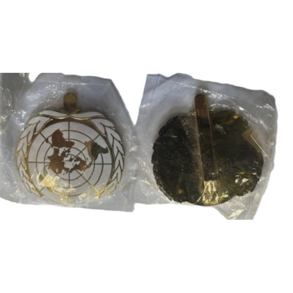 Quantity of Eight ,United Nations metal cap badges