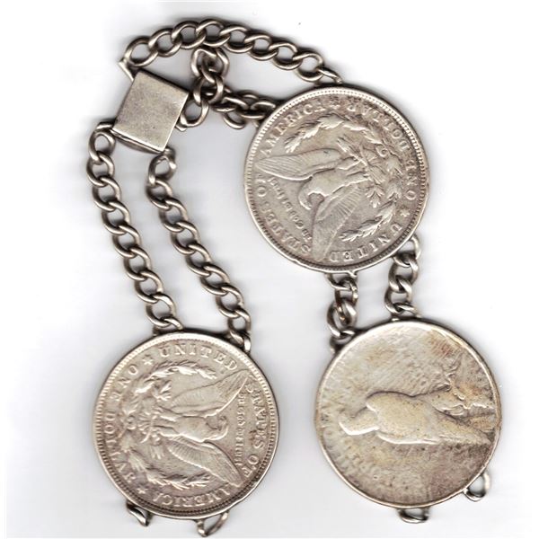 Three 93% Silver Morgan Dollars on chain , 1921, 1921 and 1922.  They are proven to be real Morgans.