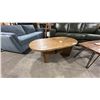 Image 1 : ASHLEY MODEL T683-0. AUSTANNY OVAL COCKTAIL TABLE. W52" D28" H17"