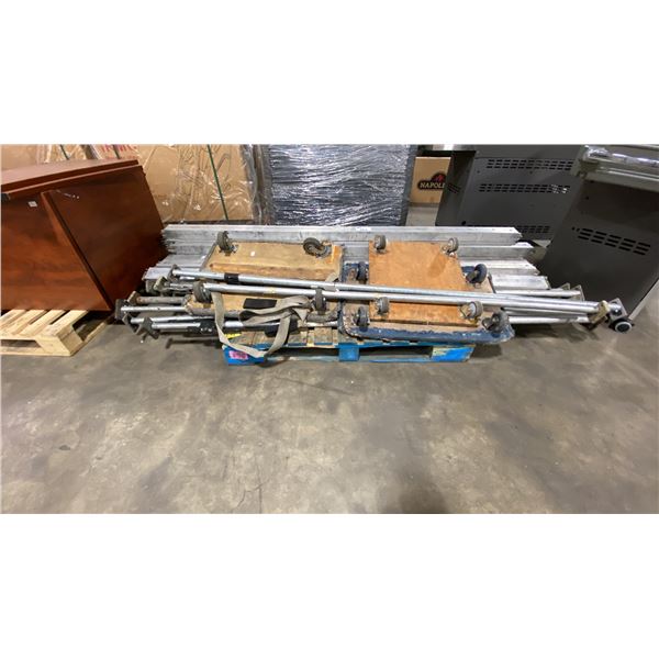 PALLET OF INDUSTRIAL E-TRACK TRANSPORT SUPPORT BARS, PRESSURE SUPPORT BARS, & 4 WHEEL MOVING CARTS