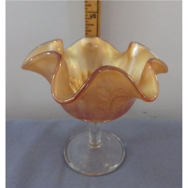 Vintage Marigold Carnival glass bowl featuring a ruffled holly pattern