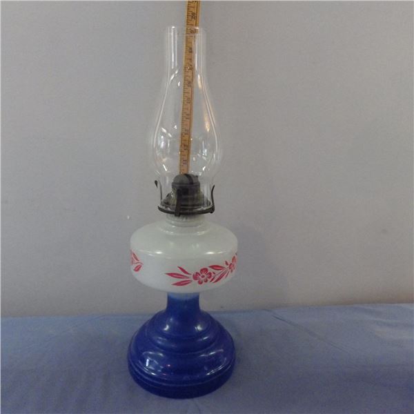 Antique Queen Anne home Sweet Home oil lamp with a blue glass pedestal base , a white milk glass fon