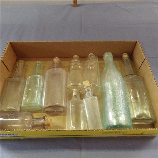 Lot of vintage glass bottles Some have embossed writing on them