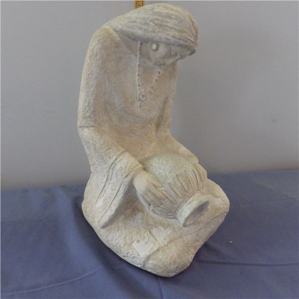 Sculpture of woman with jug