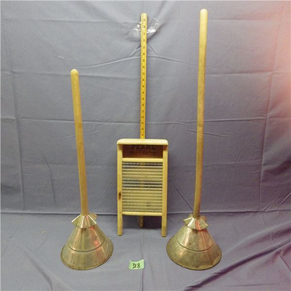 Vintage laundry plungers and washboard with glass insert
