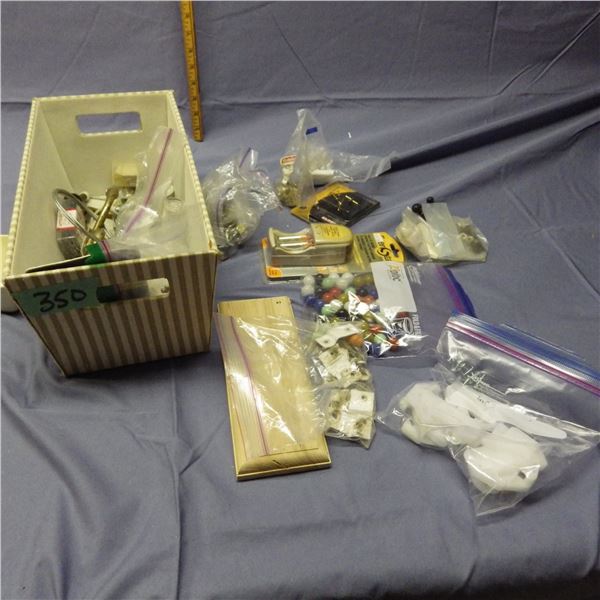 Box with coat hangers , screws etc