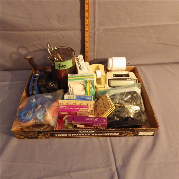 Assorted office supplies with calculator posted notes etc