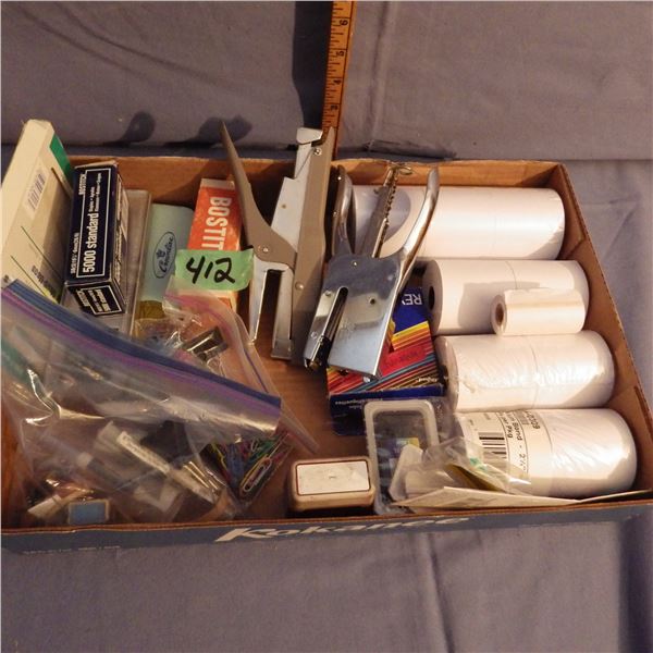 Box with adding machine tape and staples etc