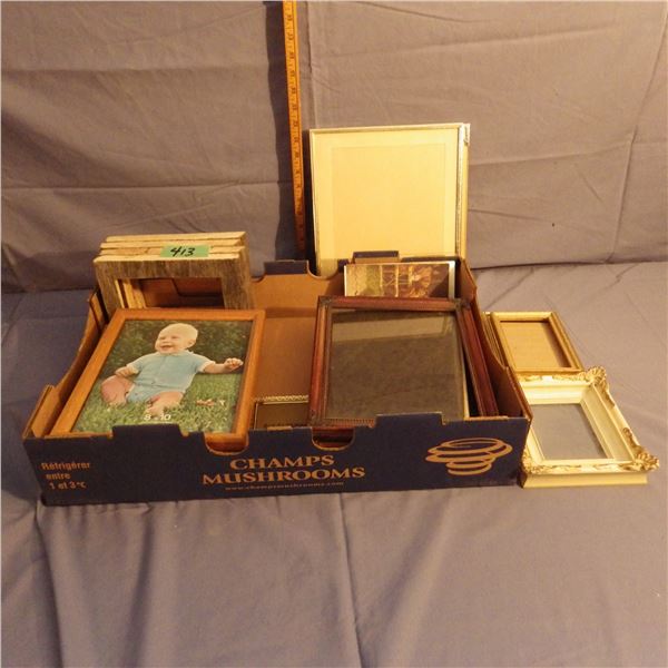Box with assorted picture frames