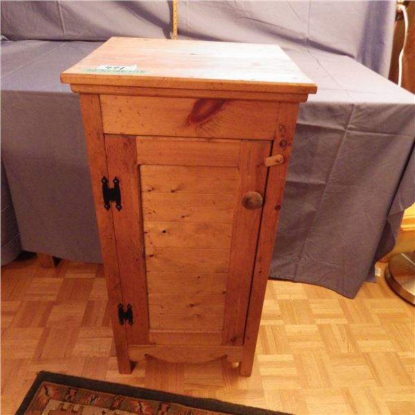 Small wood storage cabinet with door
