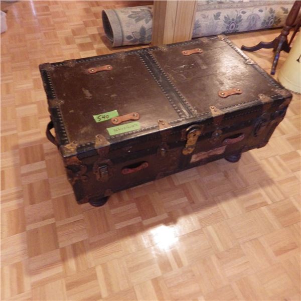 Vintage steamer trunk repurposed as a coffee table