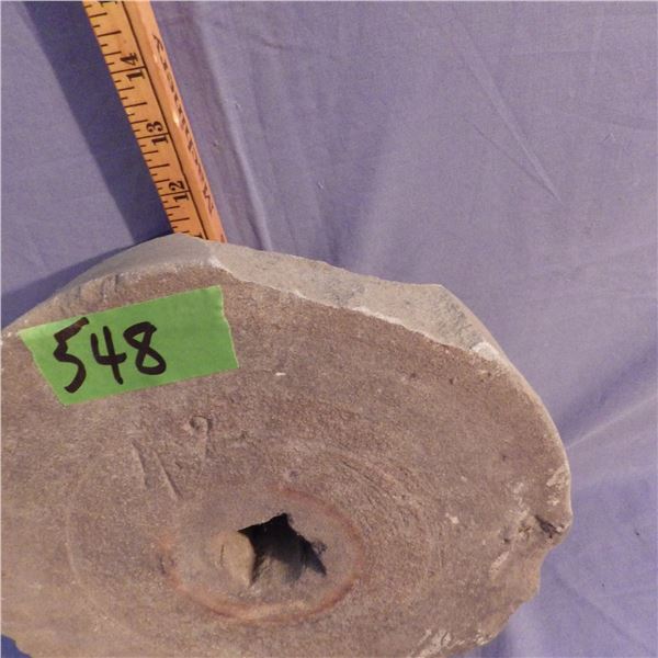 Vintage millstone wheel for grinding grain