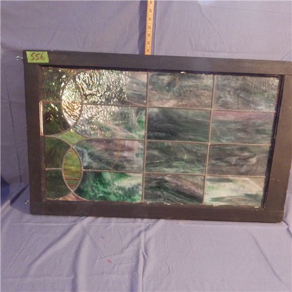 Vintage stained glass window some panes are cracked