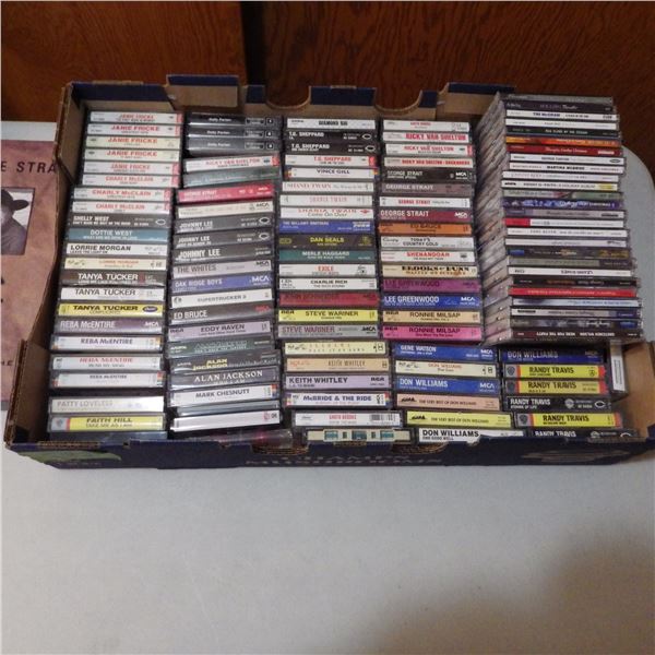 lot of assorted cassette tapes and CDS