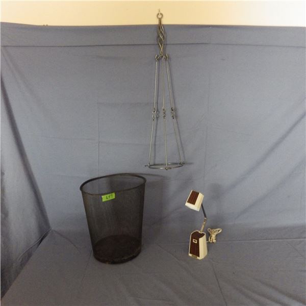 mesh metal garbage can and small light