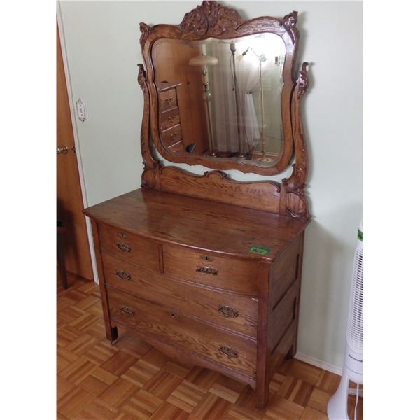 Antique oak dresser with beveled glass mirror