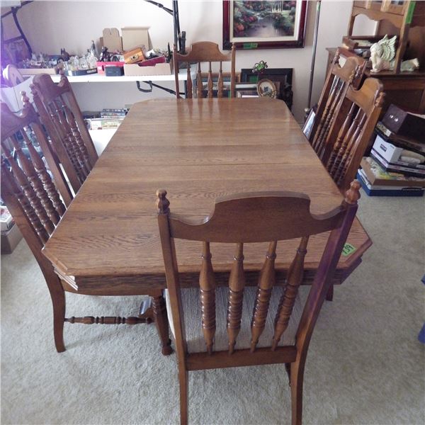 Oak dining room table with two leaves and six chairs trestle pedestal base
