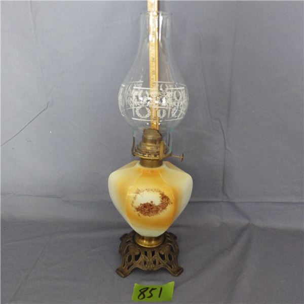 Oil lamp appears to be a milk glass font painted with flowers and has a decorative brass base