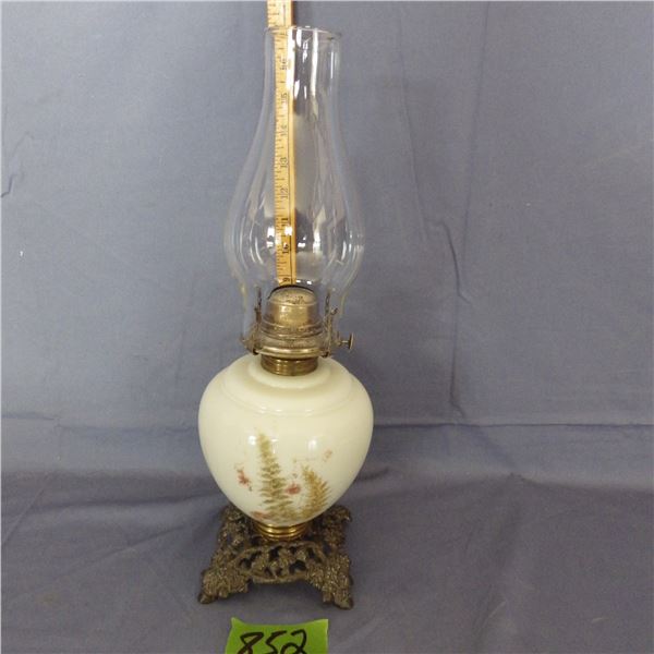 Oil lamp appears to be a milk glass font painted with Fern and floral decoration  and has a decorati