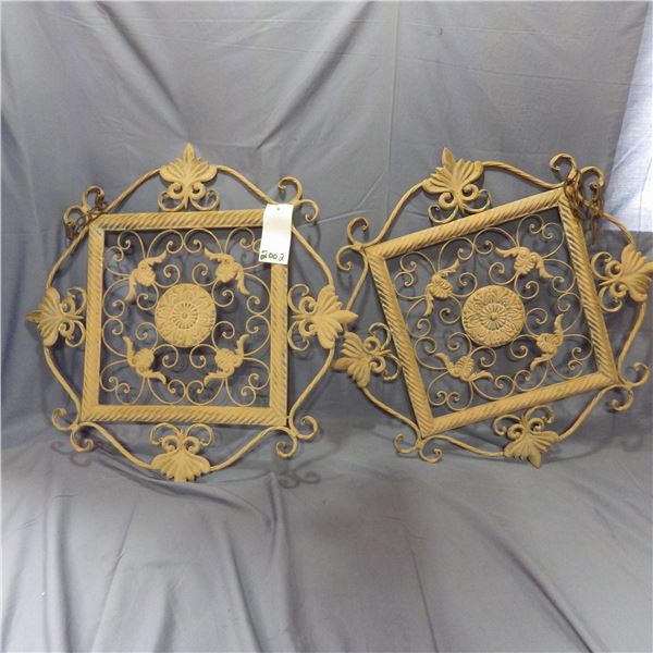 two metal decorative pieces