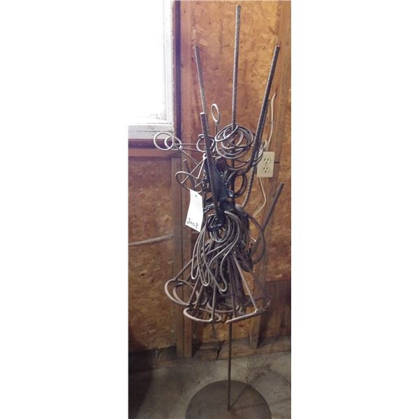 shop built stand currently holding various pieces of iron